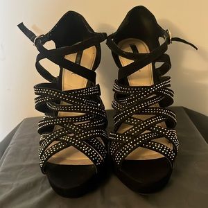 Black heels with gold embellishment